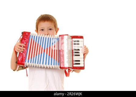 Isolated young boy playing a diatonic accordion Stock Photo