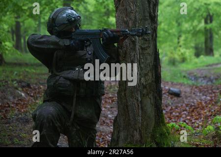 Slovak soldiers assigned to the Slovakian 22nd Mechanized Infantry Battalion patrol during Exercise Combined Resolve 18  at Hohenfels Training Area, Joint Multinational Readiness Center, Germany, May 11, 2023. Combined Resolve 18 is a U.S. Army exercise, consisting of over 4,000 service members, allies, and partners from 15 countries, and is designed to assess units' abilities to conduct combat operations effectively in a multi-domain battlespace. (U.S. Army photo by Sgt. Christian Aquino) Stock Photo