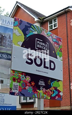 Purple Bricks online only estate agent sign - SOLD - for a pound, to rival  Charles Dunstone-backed Strike Stock Photo