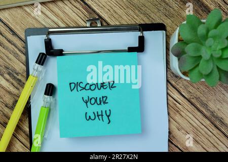 Concept of Discover Your Why write on sticky notes isolated on Wooden Table. Stock Photo
