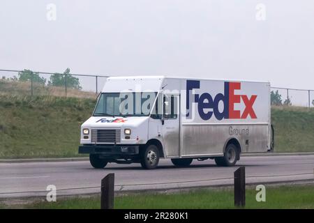 Calgary, Alberta, Canada. May 17, 2023. A FedEx delivery shipping truck van on the route. Stock Photo