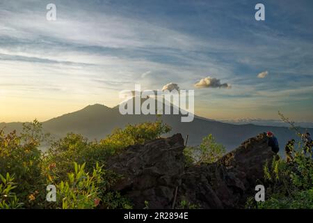 Sleeping volcano Gunung Agung in the morning sun of Bali Stock Photo