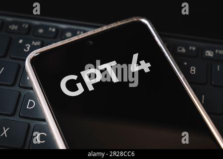 inscription GPT 4 seen on screen smartphone and laptop. Open AI - American company engaged in the development and licensing of machine learning-based Stock Photo