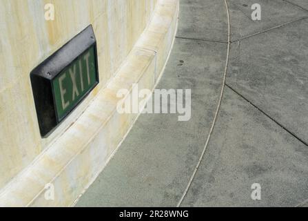 Exit sign on the wall Stock Photo