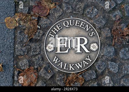 WINDSOR, UK - NOVEMBER 19 2017: A plaque marking the Queen's Walkway on the pavement Stock Photo