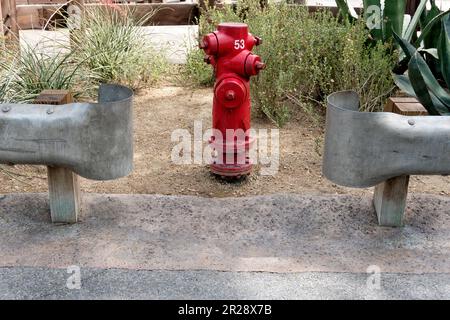 Red fire hydrant in garden Stock Photo
