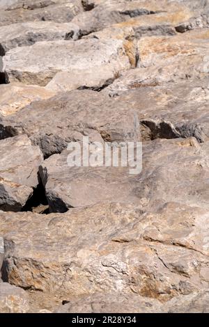 Close up view of breakwater rocks on sunny day Stock Photo