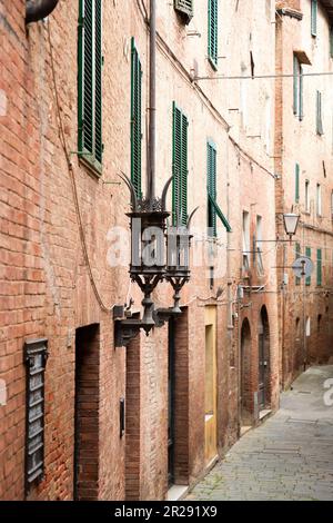 Generic architecture and street view from the historical Italian city of Siena in Tuscany. Stock Photo