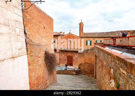 Siena, Italy - APR 7, 2022: Generic architecture and street view from the historical Italian city of Siena in Tuscany. Stock Photo