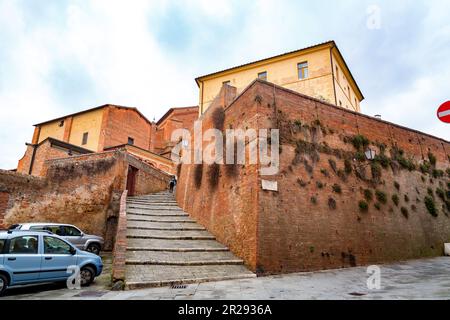 Siena, Italy - APR 7, 2022: Generic architecture and street view from the historical Italian city of Siena in Tuscany. Stock Photo