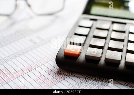 Financial accounting, Close-up numbers on paper and calculator, Many numbers on paper, Blurred background. Stock Photo