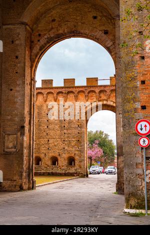 Siena, Italy - APR 7, 2022: Porta Romana is one of the portals in the medieval Walls of Siena. It is located on Via Cassia in Siena, region of Tuscany Stock Photo