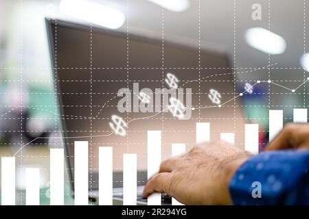 Hand of a businessman typing a notebook keyboard To analyze stock prices. A laptop screen is blank and blurry. Graph showing business performance. Wor Stock Photo