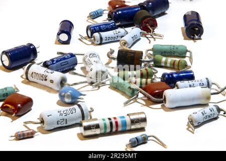 Different electronic components, resistors, capacitors, semiconductors, diodes, coils, isolated on white background Stock Photo