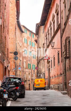 Siena, Italy - APR 7, 2022: Generic architecture and street view from the historical Italian city of Siena in Tuscany. Stock Photo