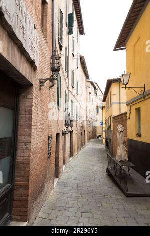 Siena, Italy - APR 7, 2022: Generic architecture and street view from the historical Italian city of Siena in Tuscany. Stock Photo