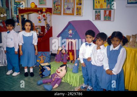 Abu Dhabi UAE Kindergarten Mixed Childrens Class Boy And Girl In School Uniform by Toys Stock Photo