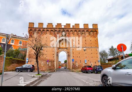 Siena, Italy - APR 7, 2022: Porta Romana is one of the portals in the medieval Walls of Siena. It is located on Via Cassia in Siena, region of Tuscany Stock Photo