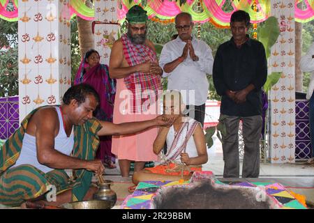 Upanayana sanskara ceremony in progress. Traditionally, this ritual was for 7, 9, and 11 year olds in South Asia, but is now practiced for all ages. Stock Photo