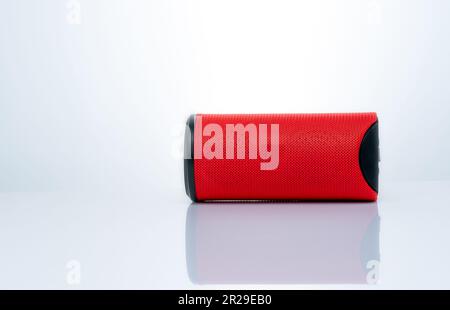 Wireless portable speaker isolated on white background. Red Digital portable speakers. Small sound music box speaker. Modern design mini portable Wire Stock Photo