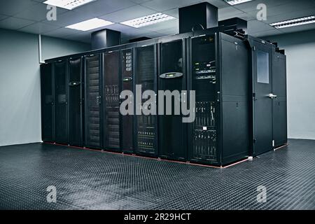 Server room, empty or hardware electronics for internet connection, admin servers or cyber security system. IT support background, information Stock Photo