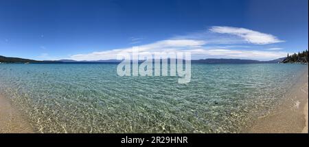 United States. 17th June, 2022. Panorama of the waters of Lake Tahoe with sand in the foreground, viewed from Lester Beach, South Lake Tahoe, California, June 17, 2022. Photo courtesy Sftm. (Photo by Gado/Sipa USA) Credit: Sipa USA/Alamy Live News Stock Photo