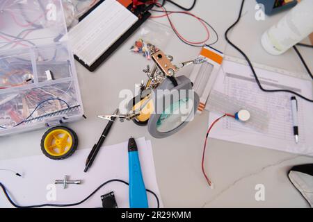 Various components and installations for robot fabrication fill the space, representing the intricate blend of technology, engineering, and innovation Stock Photo