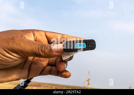 The blue VGA port of a video card showing with hand, used to transfer images from a computer to a monitor or projector Stock Photo