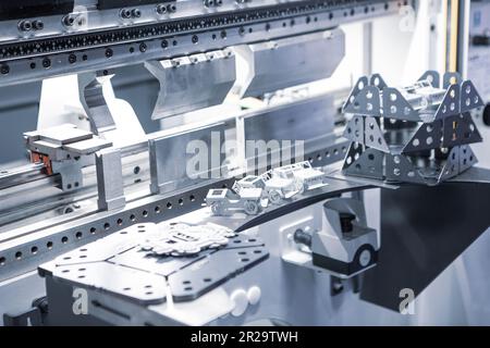 Workpieces from CNC Synchronize Hydraulic Press Brake Bending Metal Sheet Machine. Stock Photo