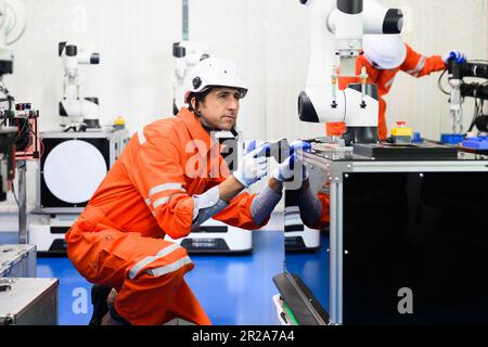 Maintenance engineer working and solving problems on machine Stock Photo