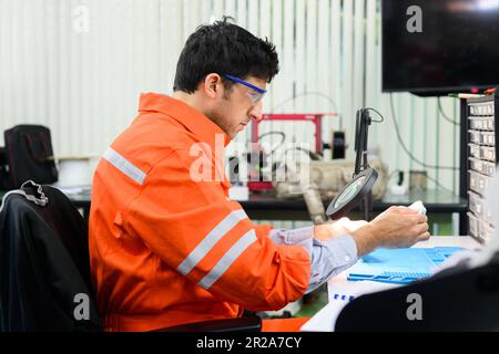 Maintenance engineer working and solving problems on machine Stock Photo