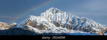Alpamayo north slope  with rainbow  (Cordillera Blanca - Perù) Stock Photo