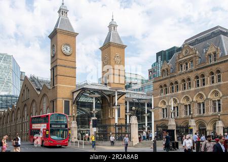 London, England-August 2022; View of the towers at the main passenger entrance of Liverpool Street station with London bus in street in front Stock Photo