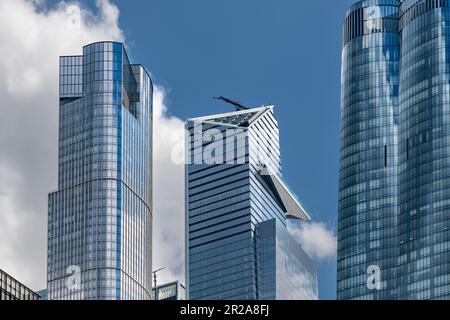 New York City, NY, USA-May 2022: Low angle view of  skyscraper with Sky deck observatory Edge in Hudson Yards surrounded by skyscrapers of Hudson Yard Stock Photo