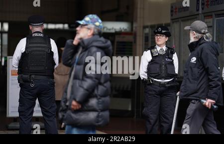 Police officers at West Croydon train station in South London performing operational activity during Operation Sceptre to tackle knife crime in Croydon. Stock Photo