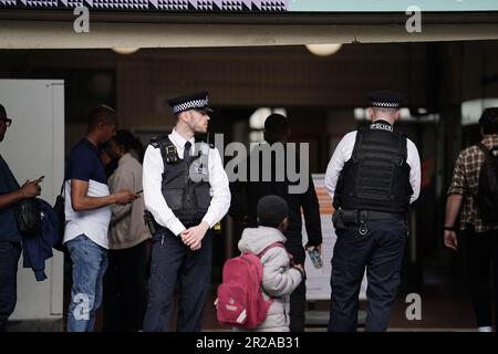 Police officers at West Croydon train station in South London performing operational activity during Operation Sceptre to tackle knife crime in Croydon. Stock Photo