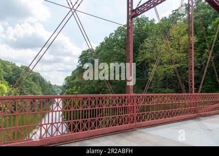 New Milford, CT, USA-August 2022; View over the Housatonic River from the wrought-iron Lover's Leap Bridge, a  lenticular truss bridge Stock Photo