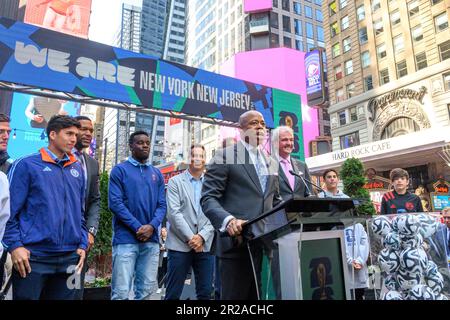 New York, USA. 18th May, 2023. New York City Mayor Eric Adams (C) speaks next to New Jersey Governor Phil Murphy (R) at a FIFA World Cup 2026 New York/New Jersey Launch Event in Times Square. The event unveiled the official themes for the MetLife stadium matches: 'We are NYNJ' and 'We are 26'. The world's top soccer competition is already planning to host 8 matches in the New York/New Jersey area and the local organizers want to host the final game here too. Credit: Enrique Shore/Alamy Live News Stock Photo