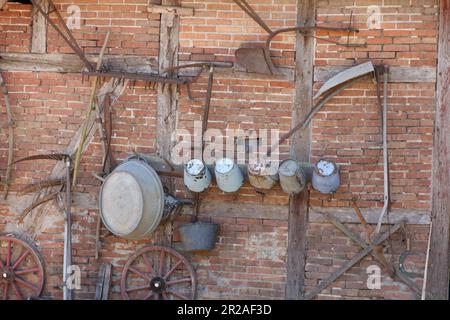 vintage buckets and trough installed at a brick wall Stock Photo