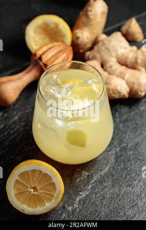 Ginger Ale with ice and lemon. Homemade lemon and ginger organic probiotic drink. Stock Photo
