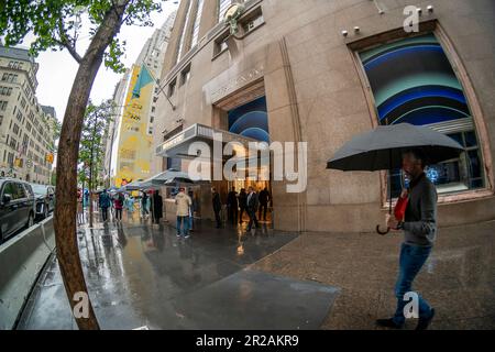 Soggy visitors brave April showers at the newly reopened Tiffany & Co. flagship store on Fifth Avenue in New York on Sunday, April 30, 2023. The store reopened after a renovation and modernization that took almost four years. Prior to the renovation the store was responsible for for 10% of the firm.s sales. (© Richard B. Levine) Stock Photo