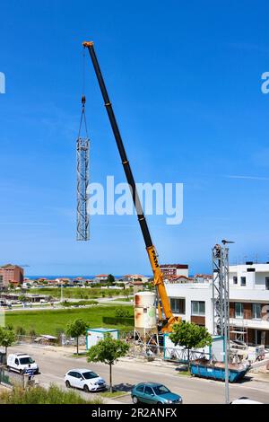 The disassembly of a tower crane Santander Cantabria Spain Stock Photo