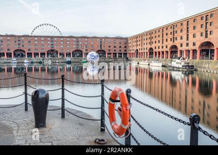 The Floating Earth sculpture in the Royal Albert Dock in Liverpool captured in May 2023 as part of hosting the Eurovision Song Content. Stock Photo