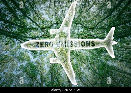 Icon of a commercial airplane with the words 'zero emissions' and a lush forest in the background. Stock Photo