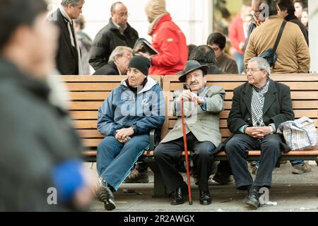 Santiago, Chile - Retired men gathered  at Plaza de Armas in Santiago de Chile. Stock Photo