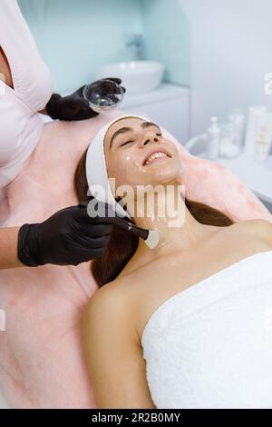 Skin peeling, Facial pampering, Skin exfoliation, Facial cosmetic treatment, Aesthetic procedure, Dermatological procedure, Chemical exfoliation, Skin revitalization Stock Photo