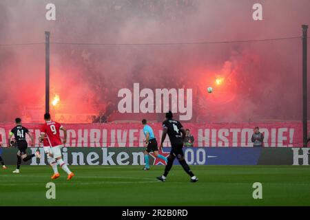 ALKMAAR - Supporters of AZ set off fireworks during the UEFA Conference League semi-final match between AZ Alkmaar and West Ham United FC at the AFAS stadium on May 18, 2023 in Alkmaar, Netherlands. ANP ED VAN DE POL Stock Photo