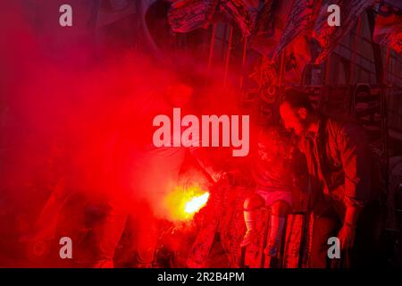 Naples, NA, Italy. 5th May, 2023. The supporters of the Napoli football team celebrate the victory of the Italian championship in the street. Father and son light colorful fireworks in the street. (Credit Image: © Gennaro Leonardi/Pacific Press via ZUMA Press Wire) EDITORIAL USAGE ONLY! Not for Commercial USAGE! Stock Photo