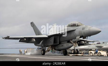 An F/A-18E attached to the 'Blacklions' of Strike Fighter Squadron (VFA) 213 lands on the first-in-class aircraft carrier USS Gerald R. Ford's (CVN 78) flight deck, May 15, 2023. VFA-213 is deployed aboard CVN 78 as part of Carrier Air Wing (CVW) 8. Gerald R. Ford is the U.S. Navy's newest and most advanced aircraft carrier, representing a generational leap in the U.S. Navy's capacity to project power on a global scale. The Gerald R. Ford Carrier Strike Group is on a scheduled deployment in the U.S. Naval Forces Europe area of operations, employed by U.S. Sixth Fleet to defend U.S., allied, an Stock Photo