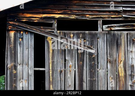 Warped boards on an old barn Stock Photo